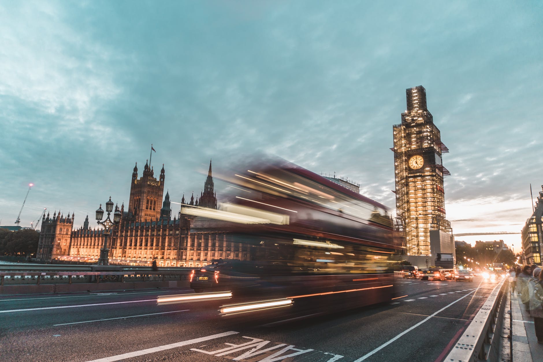 time lapse photography of vehicles passing near building